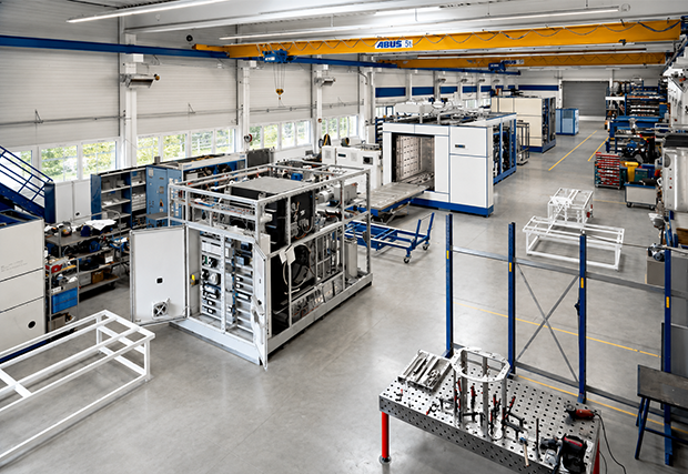 A hybrid vacuum solvent degreasing machine installed in a factory