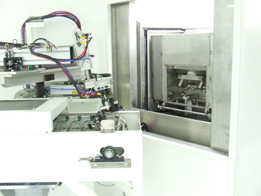 Fixture robot for carousel parts washer