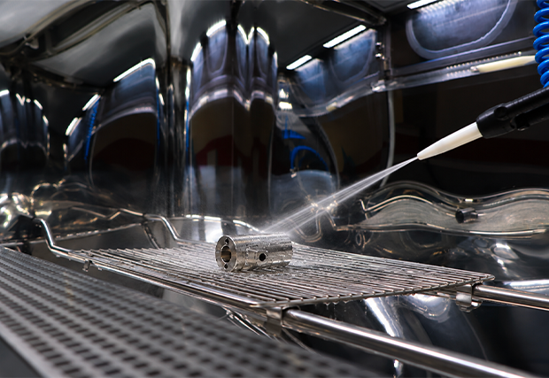 High-pressure cleaning of a part